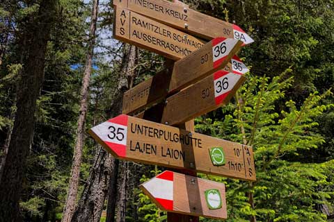 Trail signs pointing in different directions
