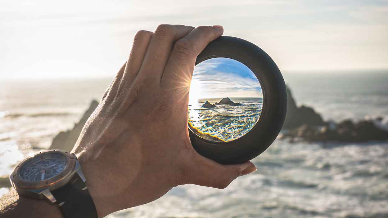 Glass focusing on ocean landscape